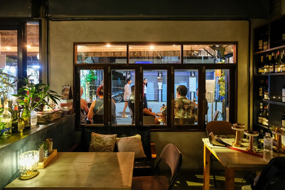 Looking out through the glass doors from the ground floor · Vermut Café, Pai Walking Street